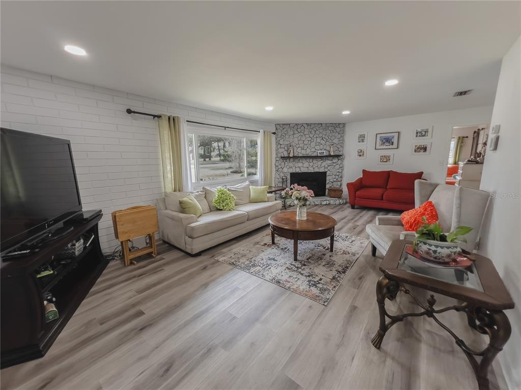 1810 Anchor Avenue DeLand, FL 32720 - Photo 3 of 29 a living room with furniture and a flat screen tv