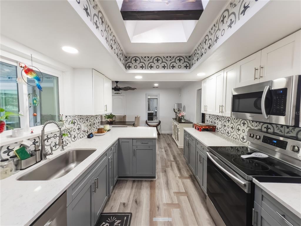 1810 Anchor Avenue DeLand, FL 32720 - Photo 7 of 29 a large white kitchen with a large window