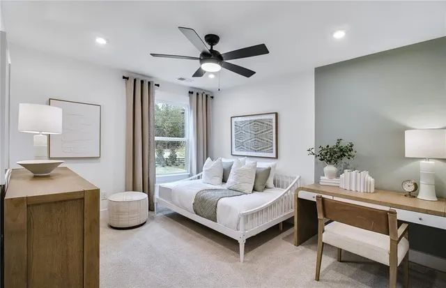 a bedroom with a bed and a table