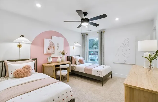 a bedroom with a bed a chandelier and a dresser