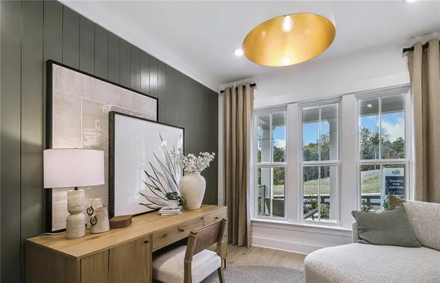 a view of living room with furniture and a large window