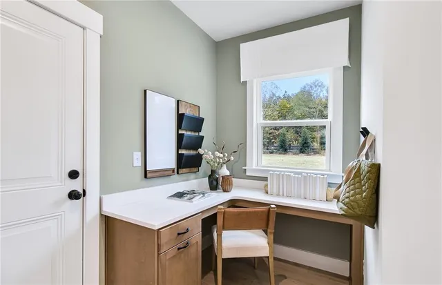 a room that has a table and a chair in it