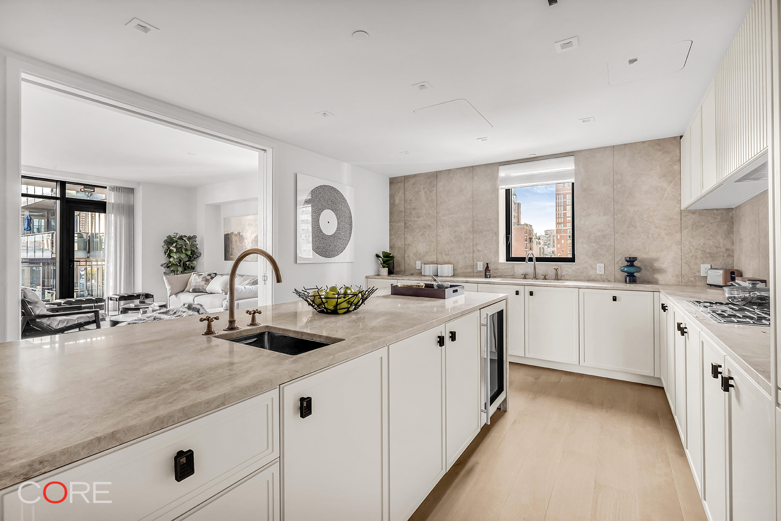 310 East 86th Street, Unit 11C Manhattan, NY 10028 - Photo 7 of 25 a large white kitchen with sink and white cabinets