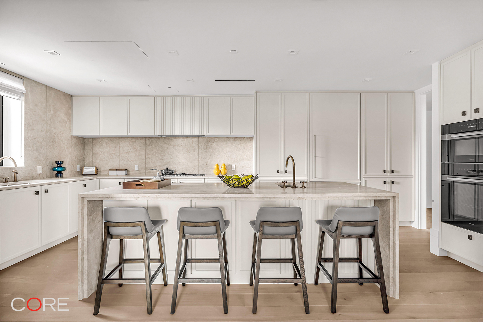310 East 86th Street, Unit 11C Manhattan, NY 10028 - Photo 8 of 25 a kitchen with a table chairs stove and cabinets
