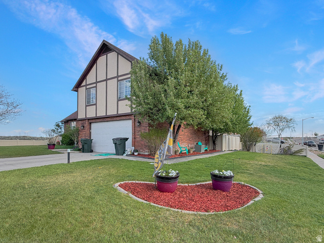 1716 Sagewood Road Price, UT 84501 - Photo 2 of 73 Brick and timber-frame exterior featuring an integrated garage