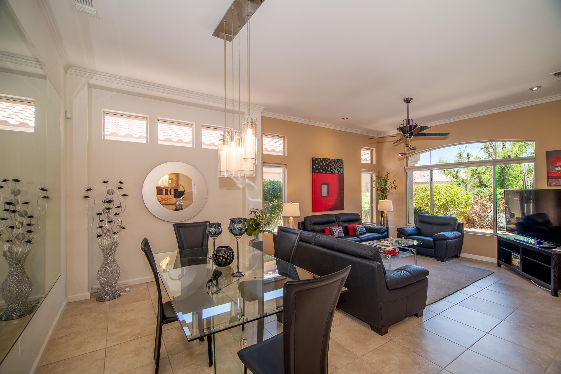 78379 Moongold Road Palm Desert, CA 92211 - Photo 14 of 40 a living room with furniture a large window and a table