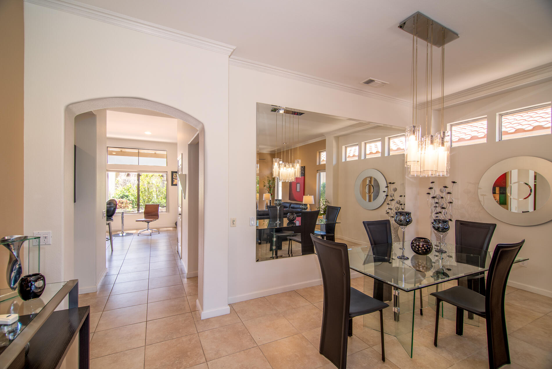 78379 Moongold Road Palm Desert, CA 92211 - Photo 16 of 40 a view of a dining room and livingroom with furniture window and wooden floor