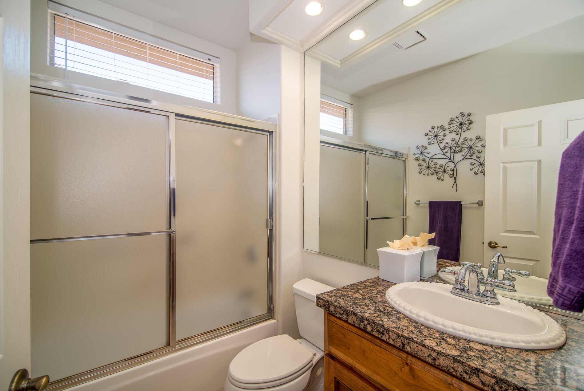 78379 Moongold Road Palm Desert, CA 92211 - Photo 24 of 40 a bathroom with a granite countertop sink toilet and shower