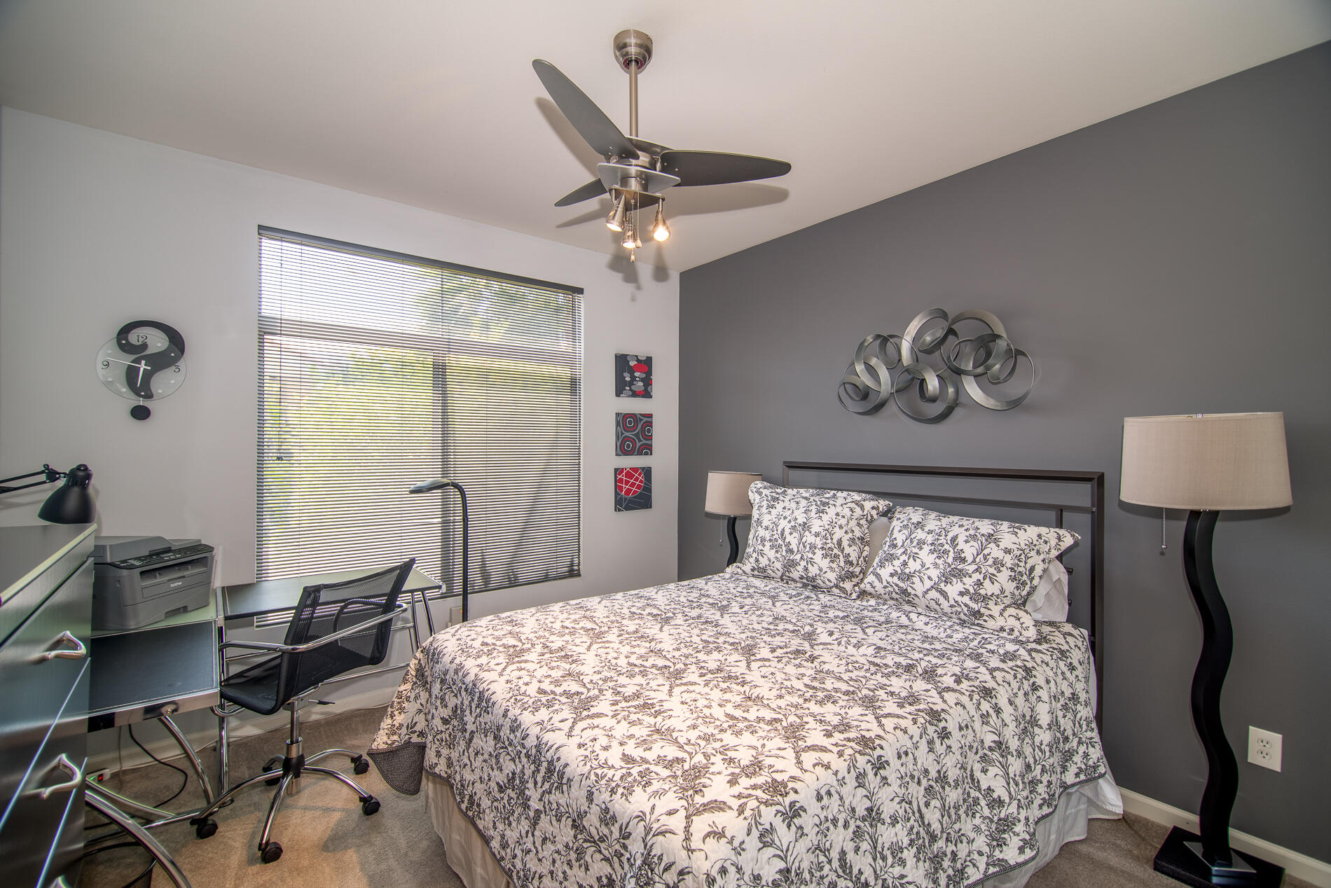 78379 Moongold Road Palm Desert, CA 92211 - Photo 25 of 40 a bedroom with a bed and a table in it
