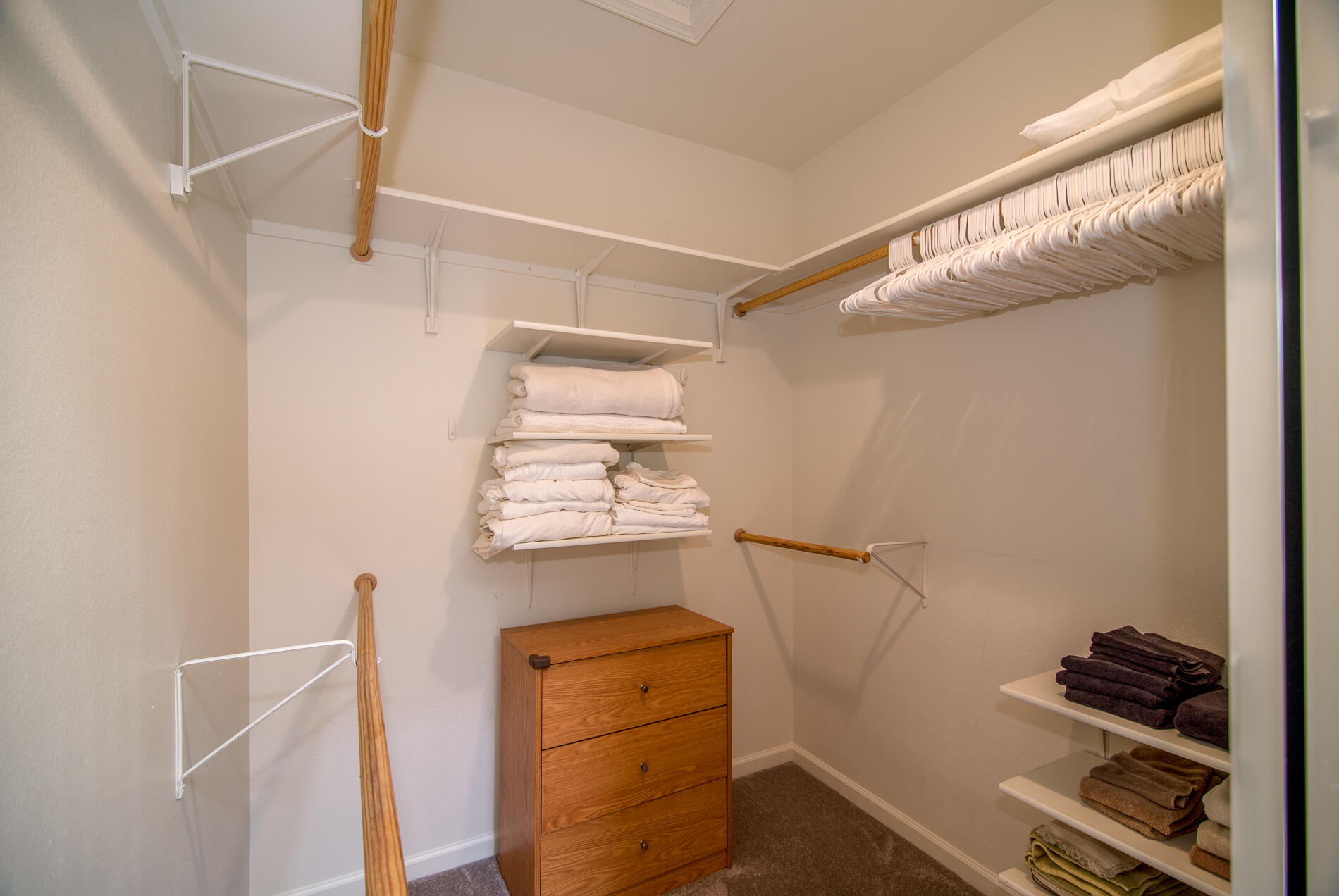 78379 Moongold Road Palm Desert, CA 92211 - Photo 29 of 40 a view of walk in closet with clothes and shoes