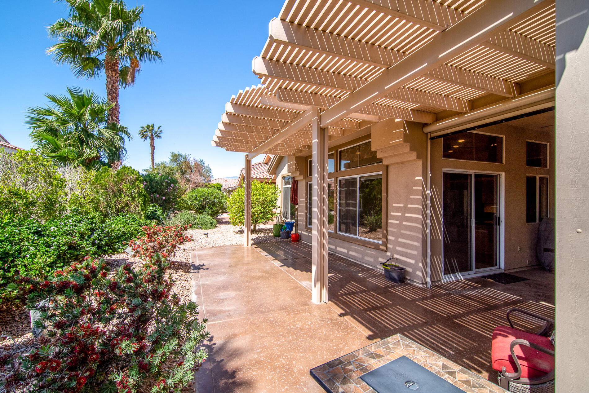 78379 Moongold Road Palm Desert, CA 92211 - Photo 9 of 40 a view of a house with potted plants