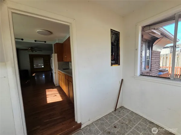 a large kitchen with stainless steel appliances kitchen island granite countertop a sink and wooden cabinets