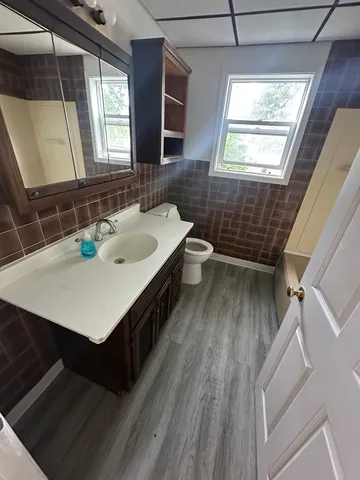 a bathroom with a sink a vanity and a mirror