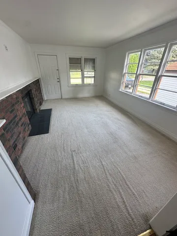 a view of an empty room and window