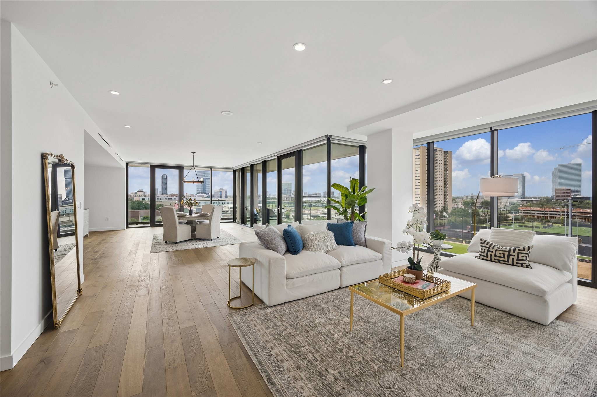 3433 Westheimer Road, Unit 702 Houston, TX 77027 - Photo 1 of 48 Welcome home - where floor-to-ceiling glass and sweeping city views create an unforgettable first impression! A 303-square-foot balcony, blending indoor luxury with spectacular outdoor views.