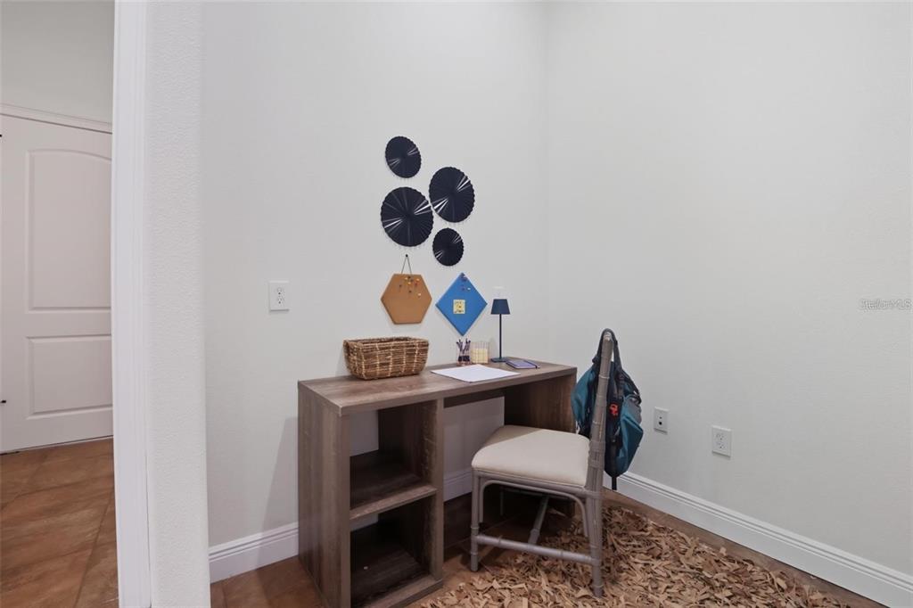 3215 Gulf City Road Ruskin, FL 33570 - Photo 33 of 99 a view of a workspace with furniture and wooden floor