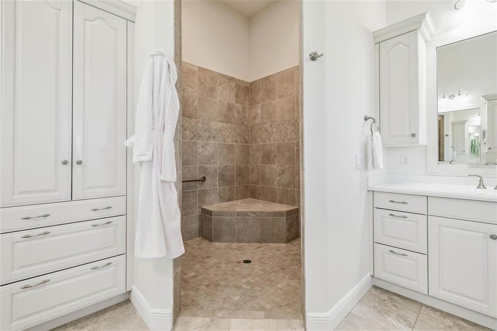 3215 Gulf City Road Ruskin, FL 33570 - Photo 53 of 99 a bathroom with a sink a toilet and shower