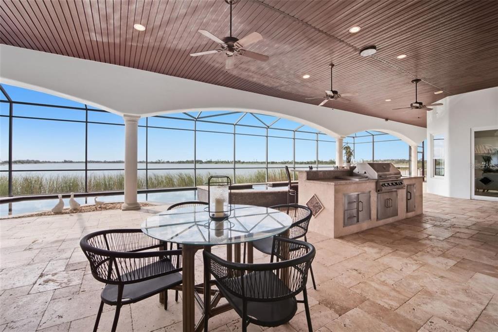 3215 Gulf City Road Ruskin, FL 33570 - Photo 61 of 99 a kitchen with a table chairs and a kitchen