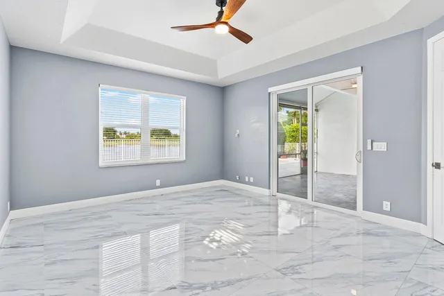 a bathroom with a bathtub shower sink vanity and mirror