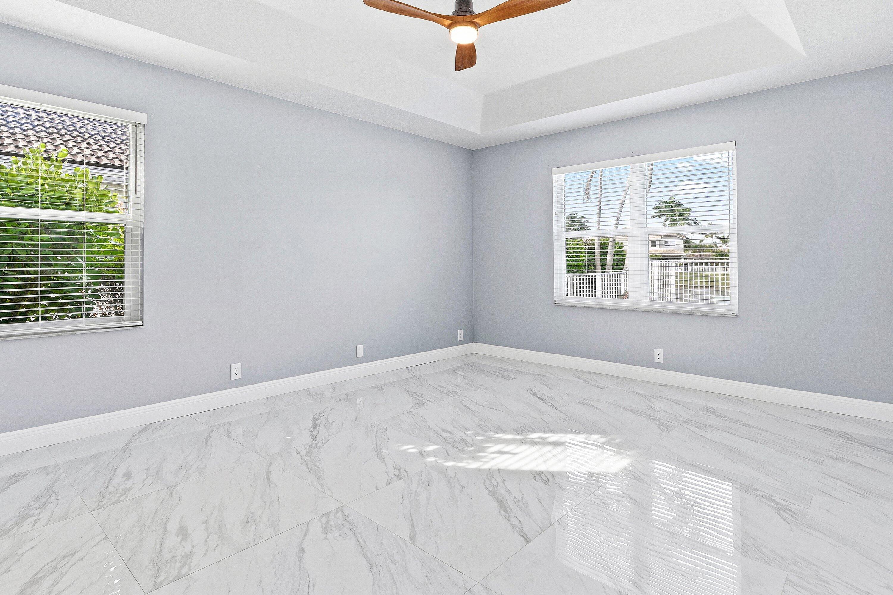 12403 Cascades Pointe Drive Boca Raton, FL 33428 - Photo 18 of 65 a view of an empty room with a window