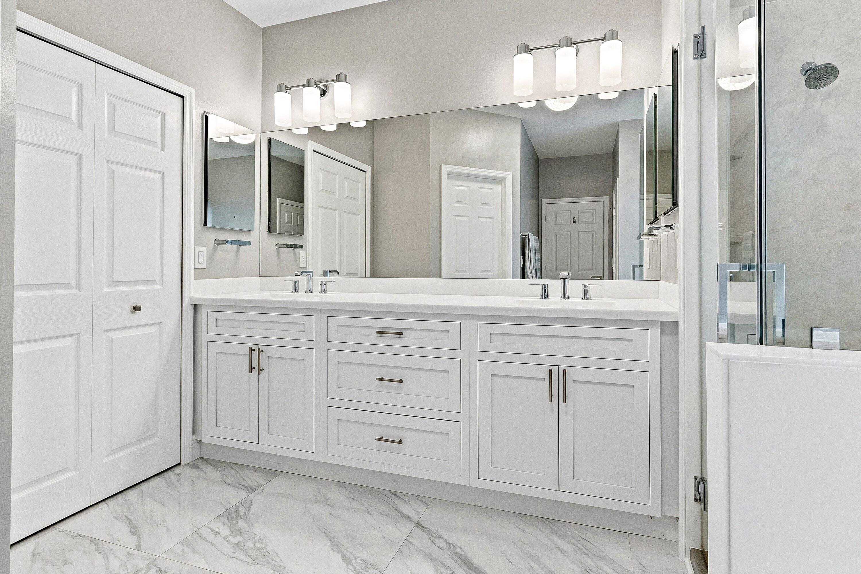 12403 Cascades Pointe Drive Boca Raton, FL 33428 - Photo 20 of 65 a bathroom with a sink vanity and a mirror