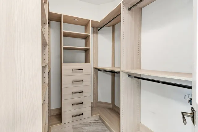 a view of a house with swimming pool and sitting area