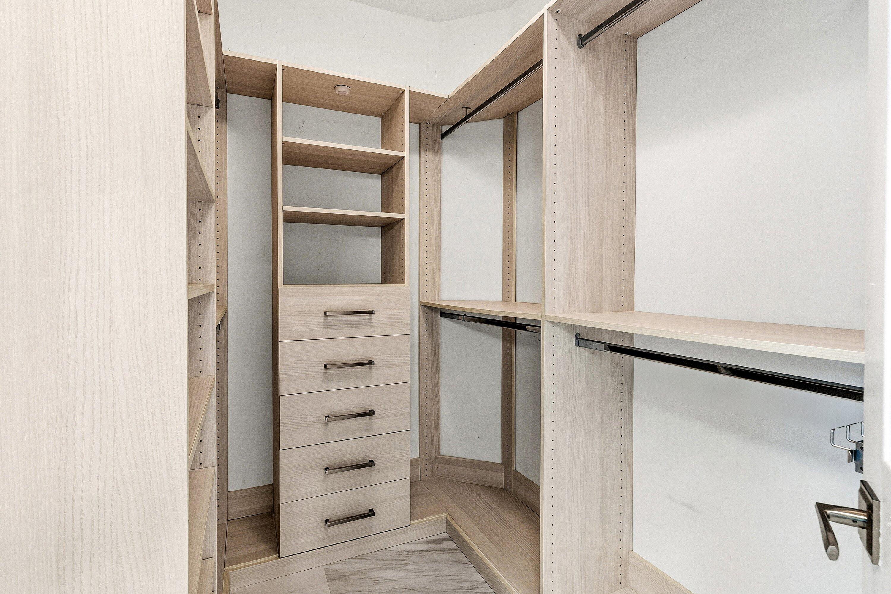 12403 Cascades Pointe Drive Boca Raton, FL 33428 - Photo 21 of 65 a view of walk in closet with empty racks