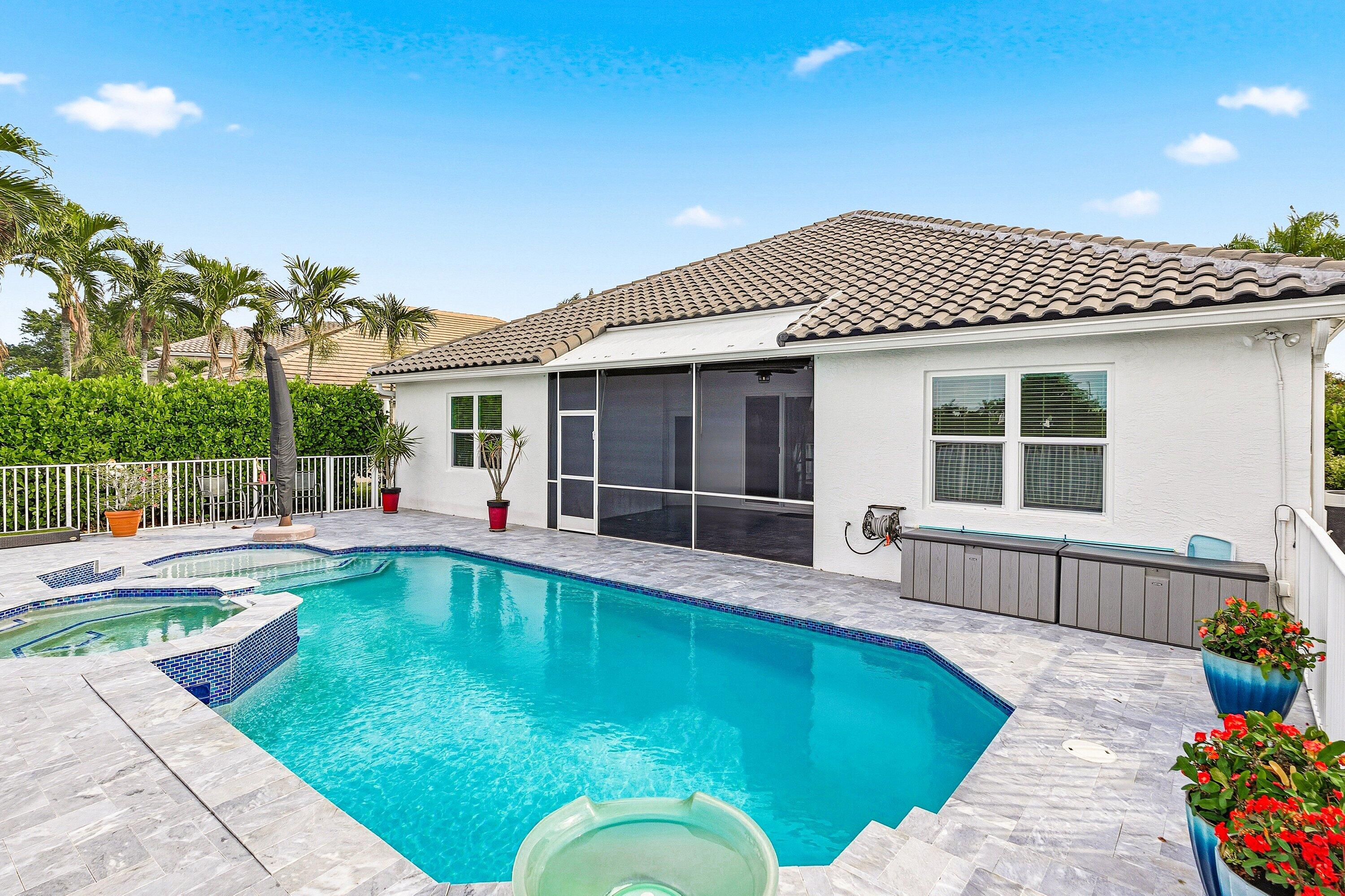 12403 Cascades Pointe Drive Boca Raton, FL 33428 - Photo 27 of 65 a view of a house with swimming pool and sitting area