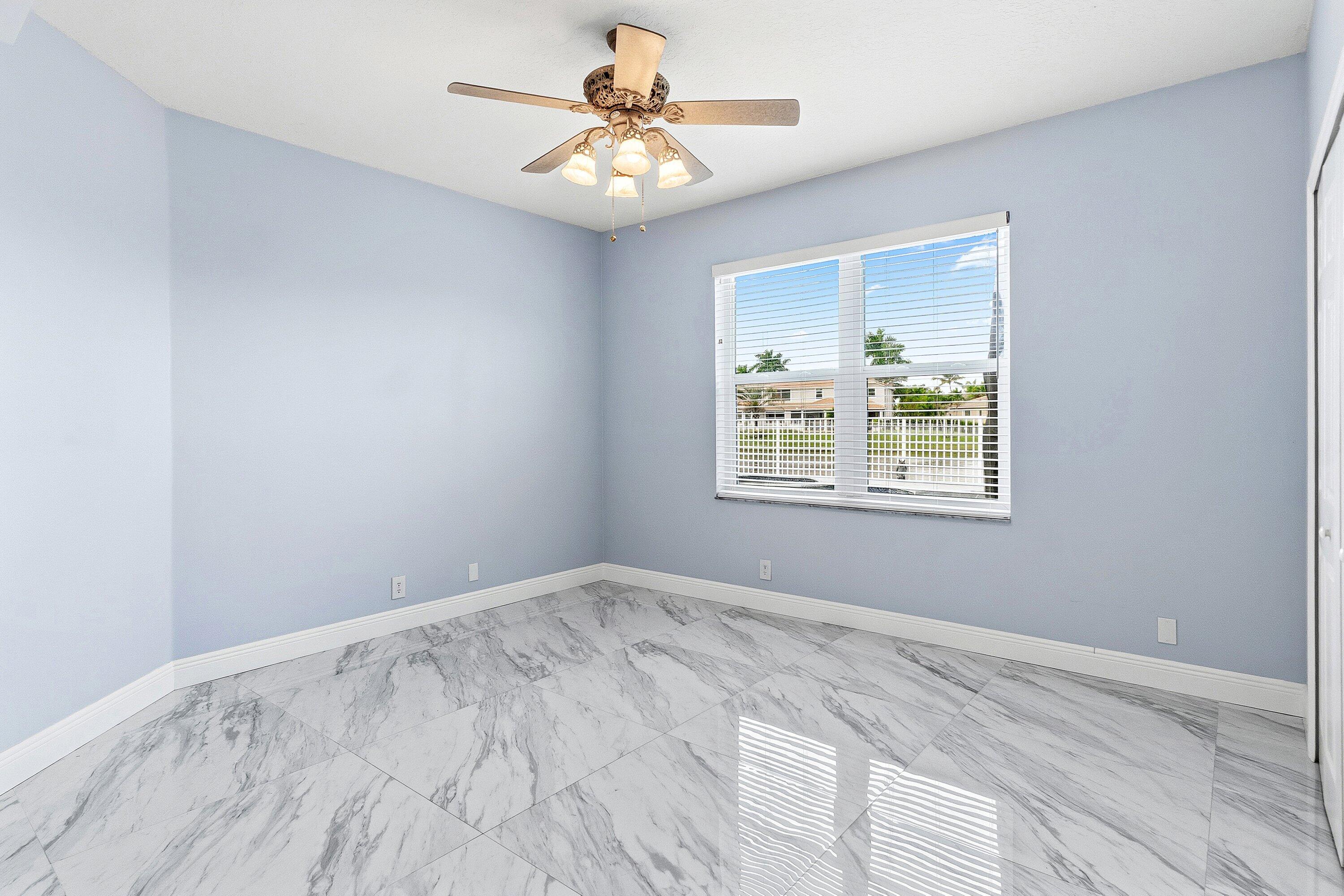 12403 Cascades Pointe Drive Boca Raton, FL 33428 - Photo 29 of 65 a view of an empty room with a window