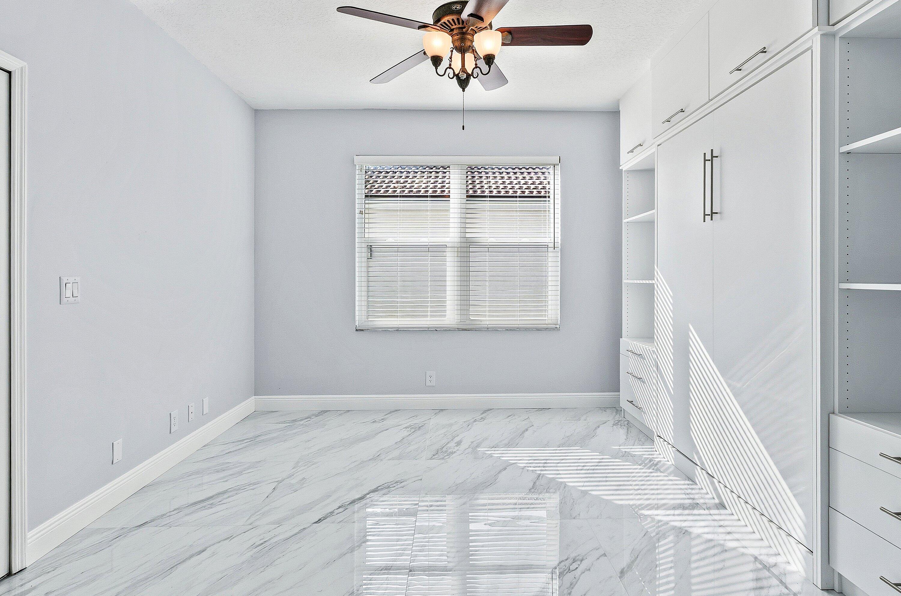 12403 Cascades Pointe Drive Boca Raton, FL 33428 - Photo 30 of 65 a view of an empty room with a window
