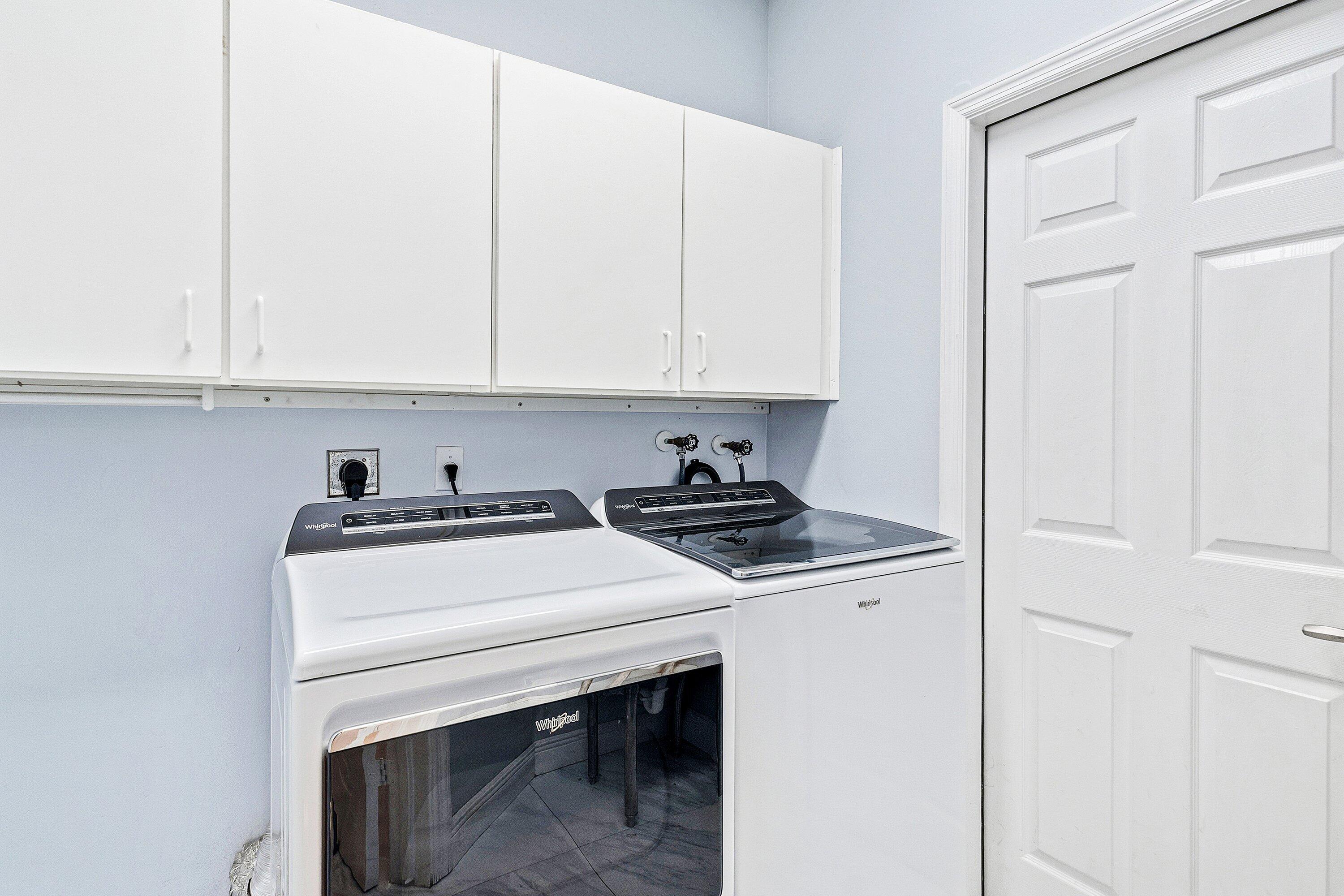 12403 Cascades Pointe Drive Boca Raton, FL 33428 - Photo 33 of 65 a view of washer and dryer with kitchen countertops