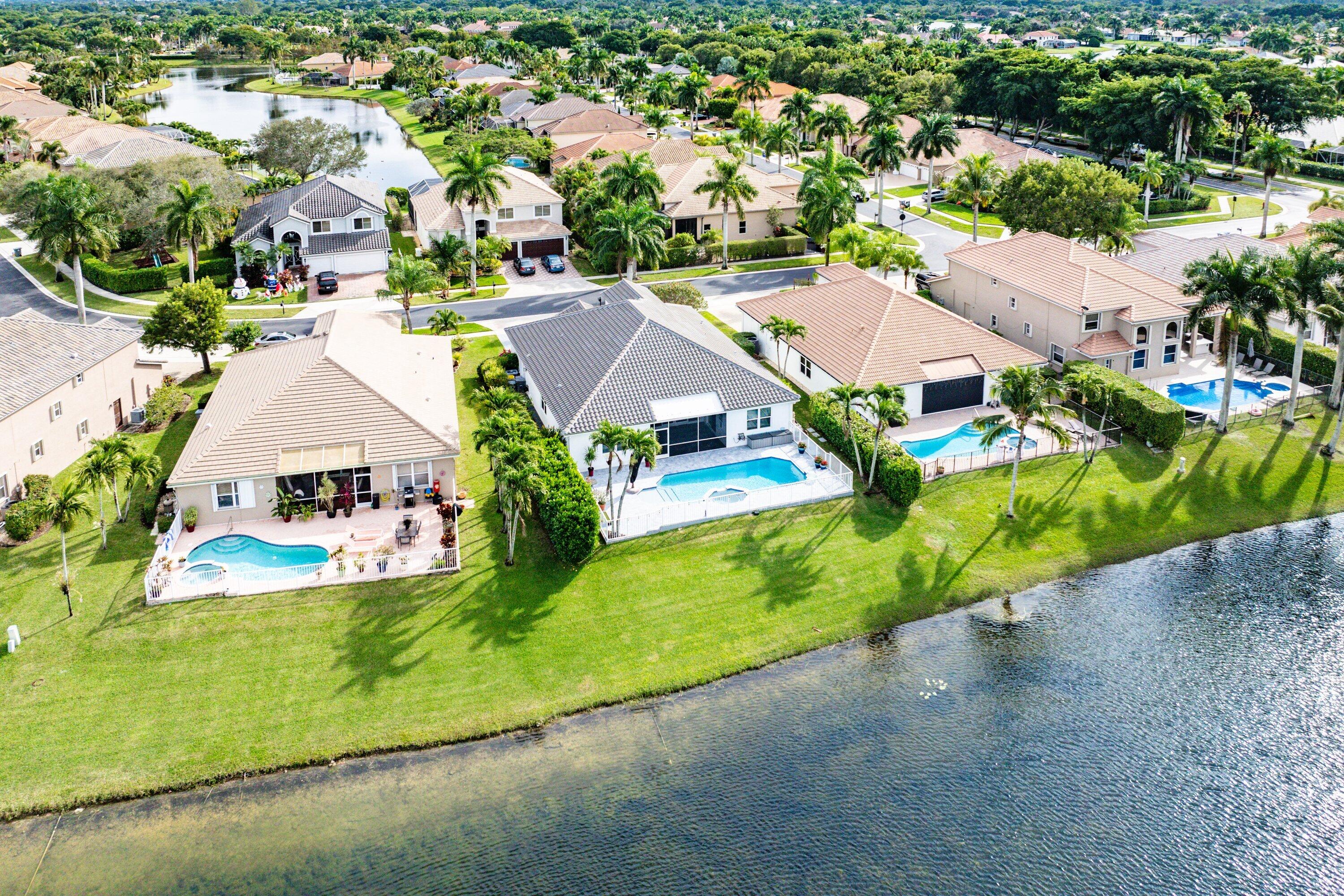 12403 Cascades Pointe Drive Boca Raton, FL 33428 - Photo 43 of 65 an aerial view of residential houses with outdoor space and parking