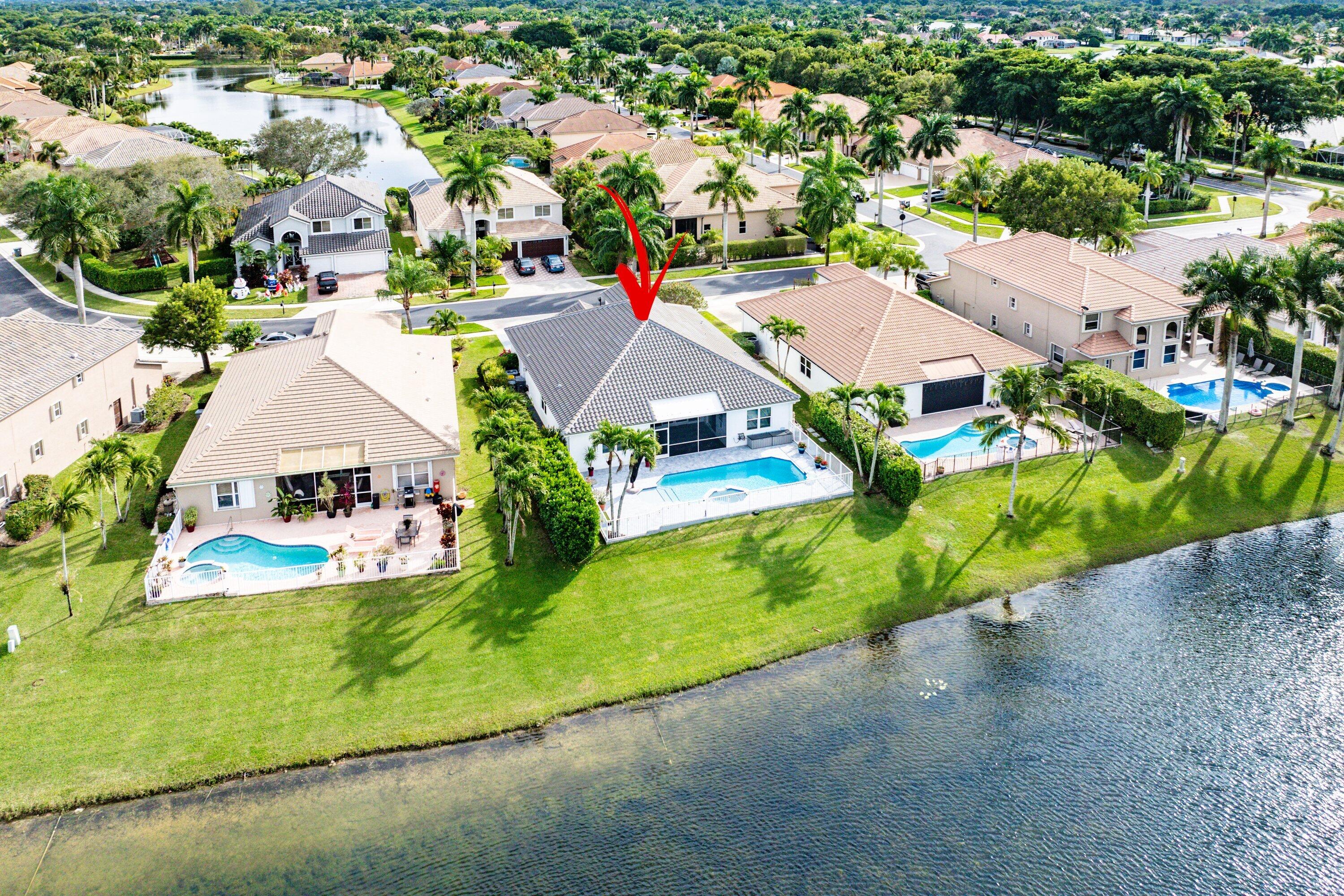 12403 Cascades Pointe Drive Boca Raton, FL 33428 - Photo 44 of 65 an aerial view of residential houses with outdoor space and parking