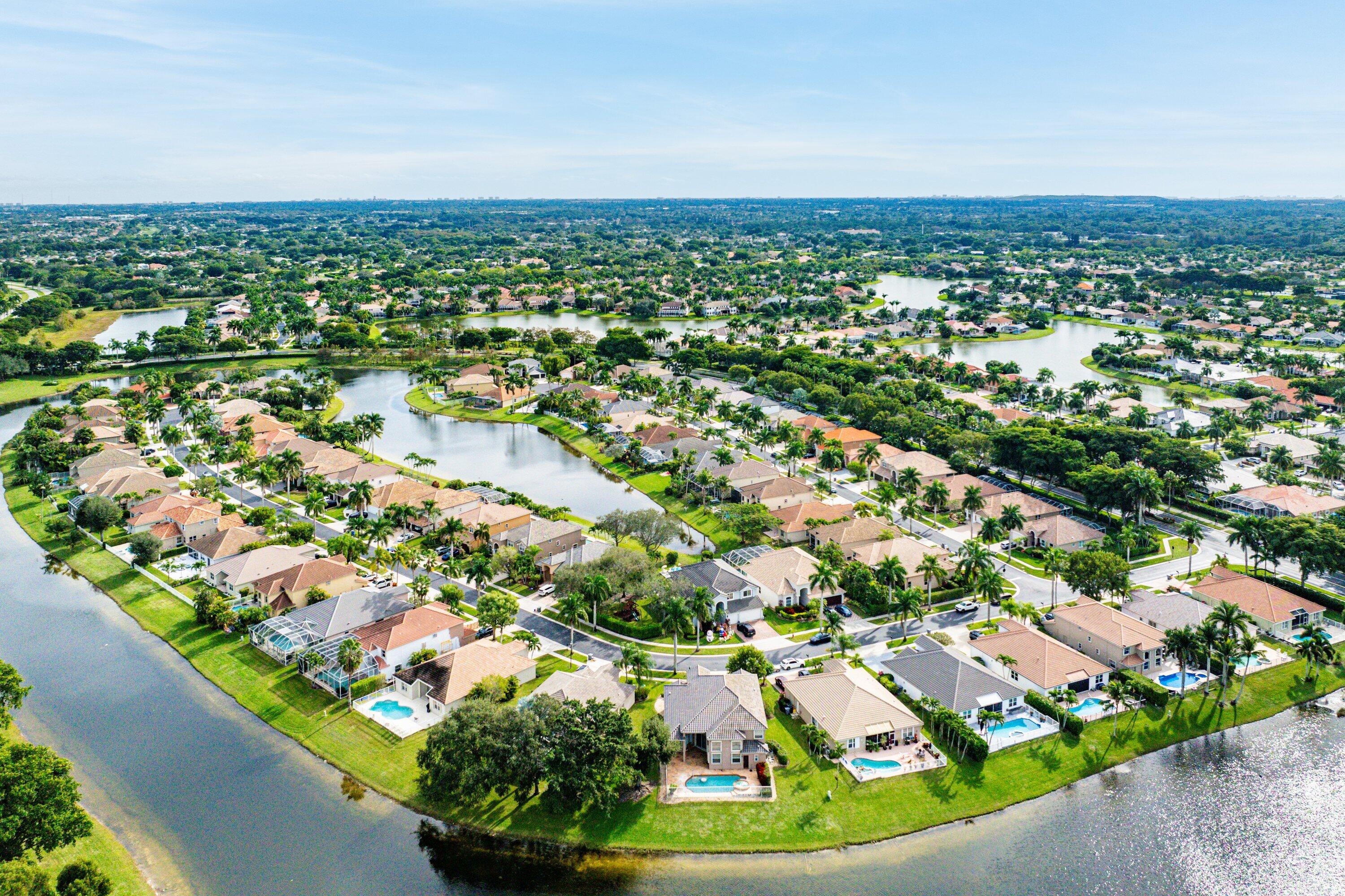 12403 Cascades Pointe Drive Boca Raton, FL 33428 - Photo 48 of 65 an aerial view of residential houses with outdoor space and trees