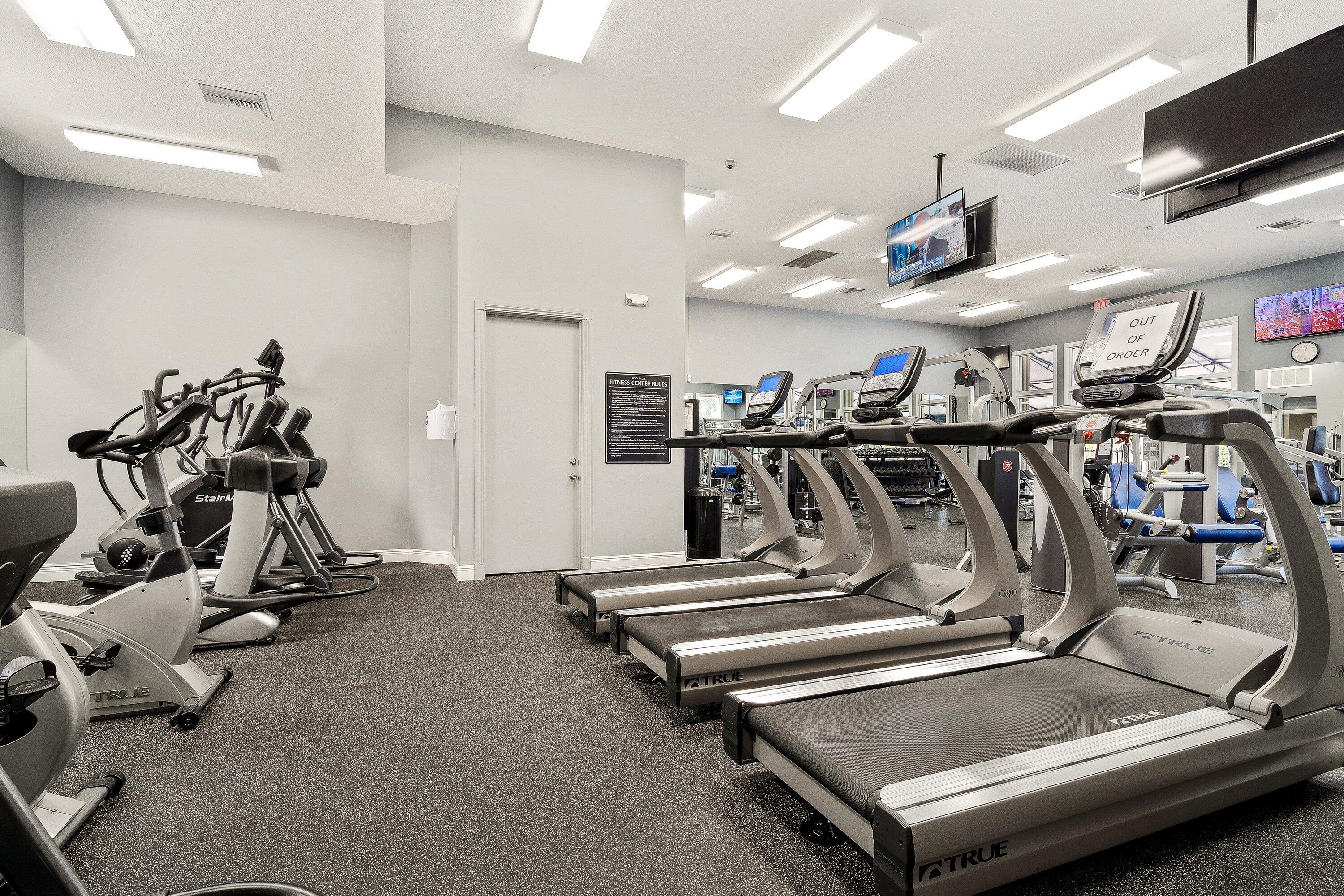 12403 Cascades Pointe Drive Boca Raton, FL 33428 - Photo 56 of 65 a view of a room with gym equipment