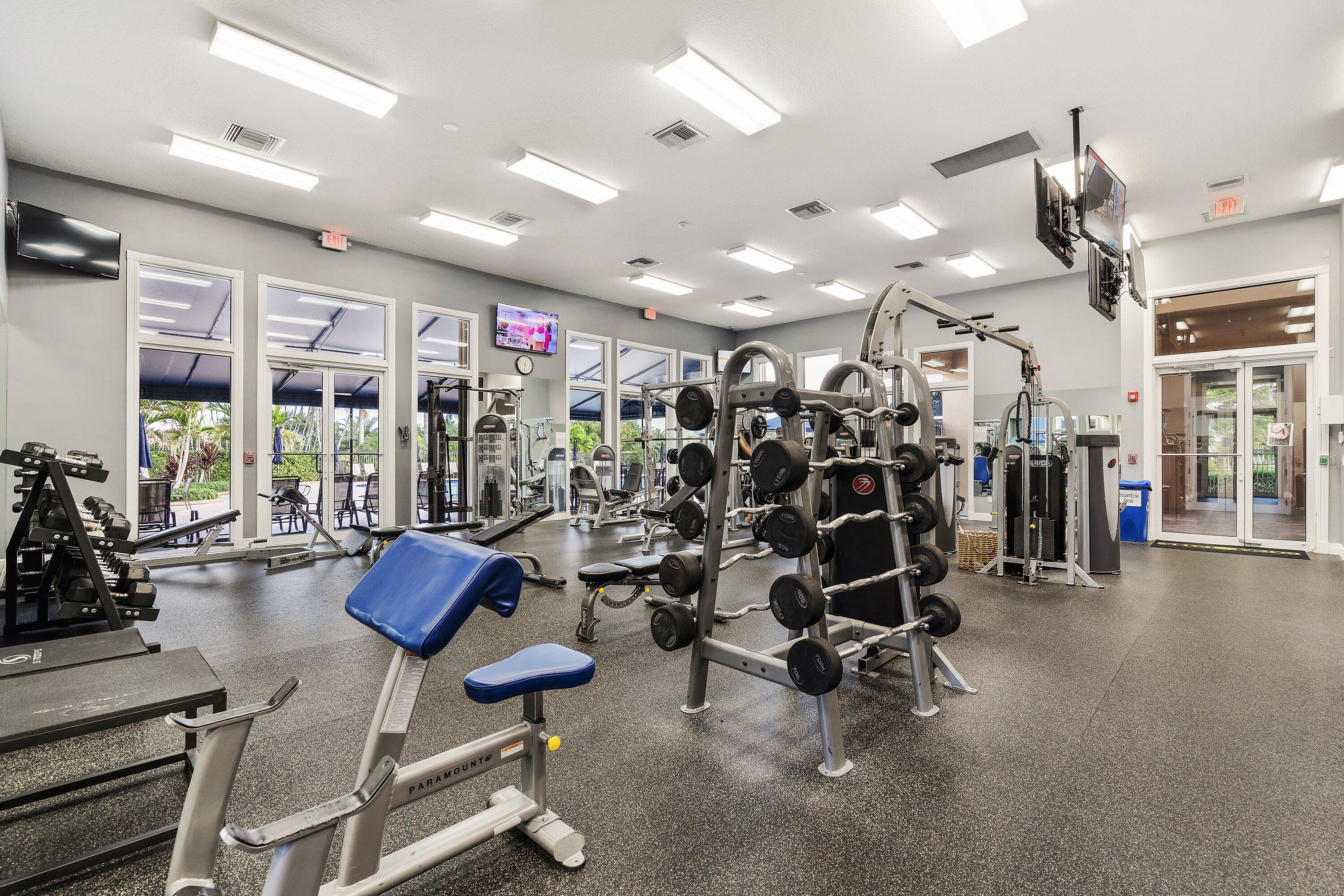 12403 Cascades Pointe Drive Boca Raton, FL 33428 - Photo 57 of 65 a view of a room with gym equipment