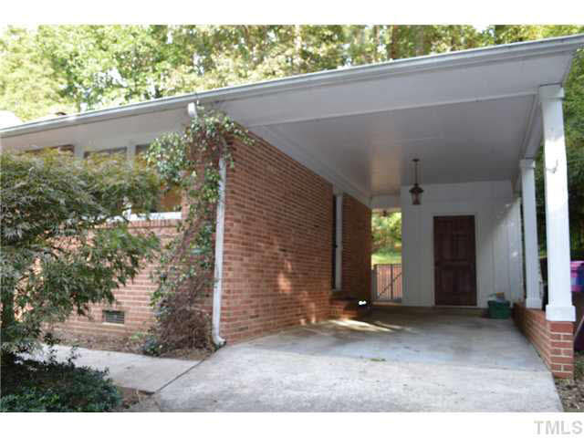 2516 Oxford Road Raleigh, NC 27608 - Photo 19 of 23 Room for two cars is provided by the carport and an adjacent parking pad.