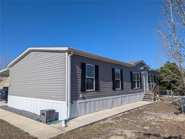 a living room with furniture fireplace and flat screen tv