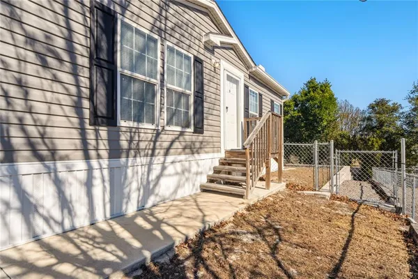 a kitchen with kitchen island a sink stove and refrigerator