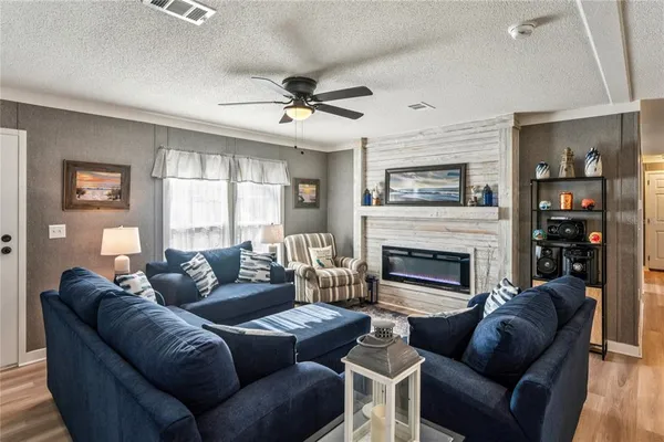 a kitchen with stainless steel appliances granite countertop a sink and a refrigerator