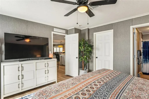 a work room with furniture and a flat screen tv