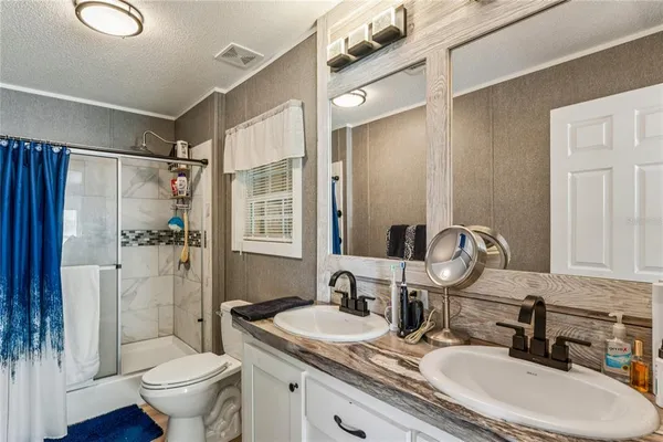a view of a workspace with furniture and wooden floor