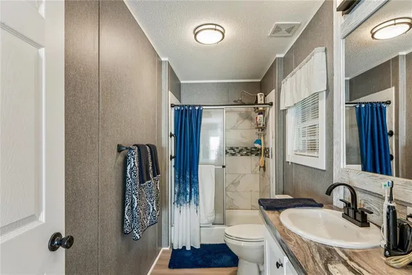 a view of a hallway with washer and dryer