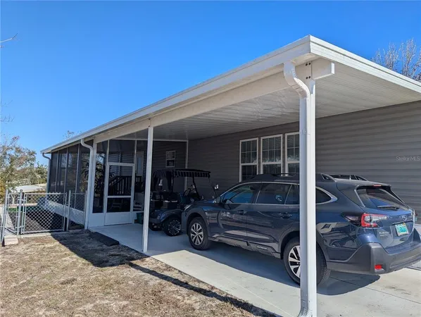 a front view of a house with a large window