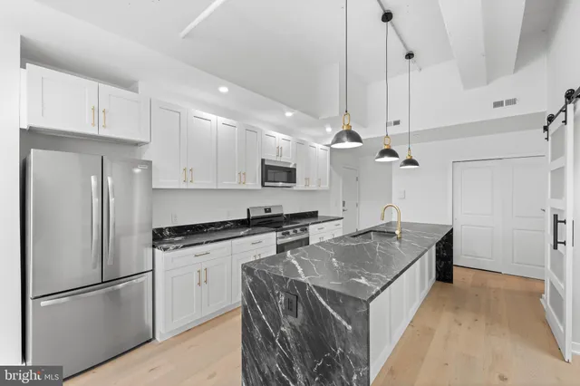a bathroom with a toilet sink and a bathtub