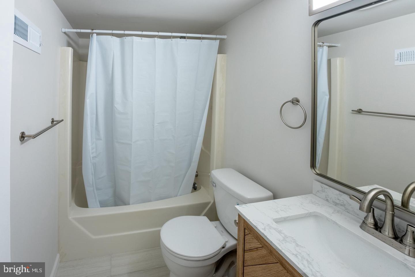 5629 Signal Point Court Burke, VA 22015 - Photo 25 of 48 a white toilet sitting next to a bathroom sink