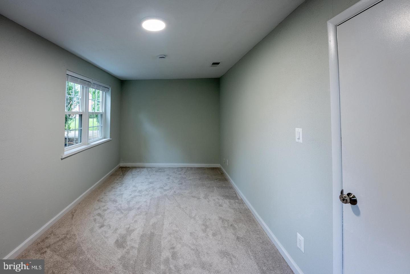 5629 Signal Point Court Burke, VA 22015 - Photo 26 of 48 an empty room with windows