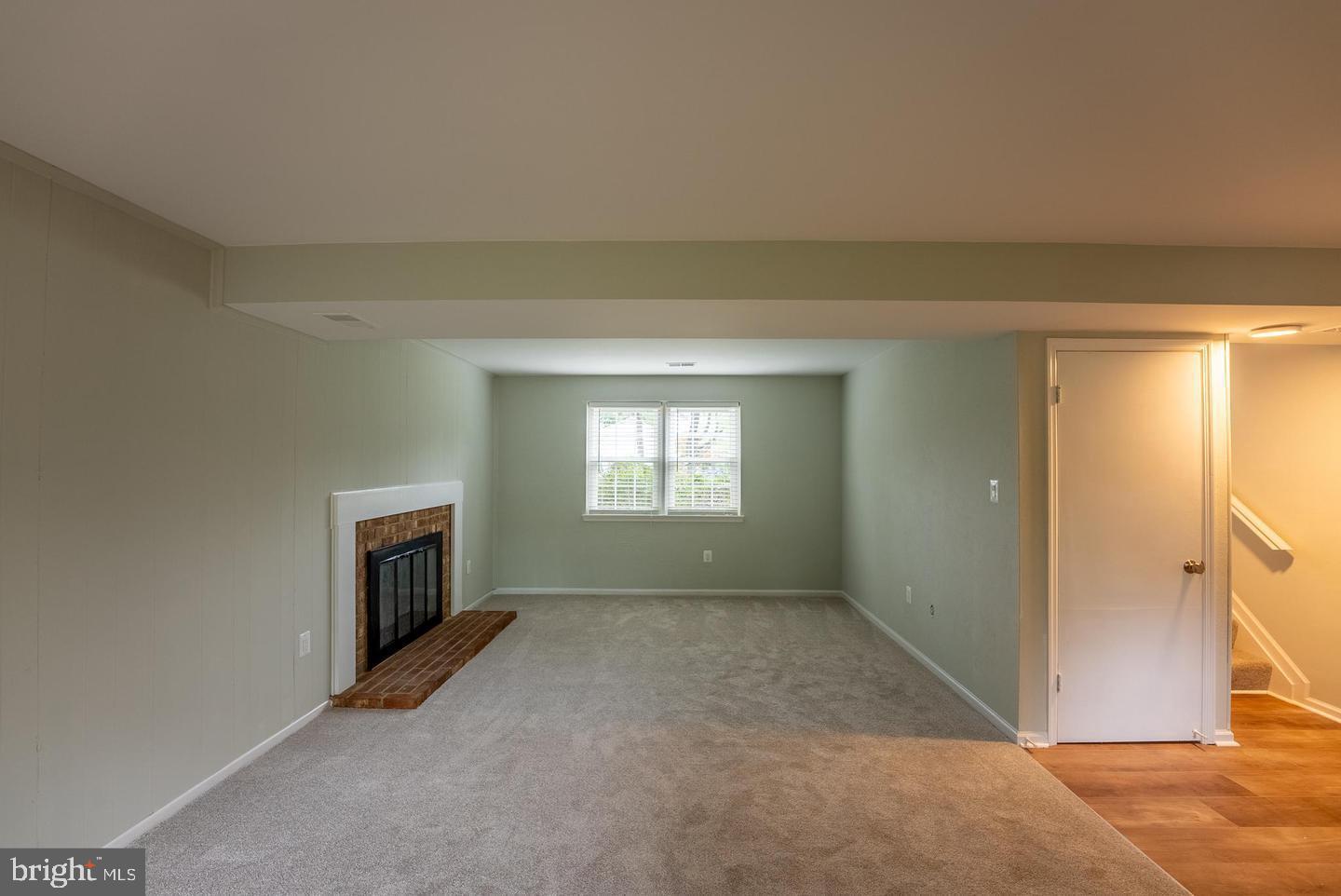 5629 Signal Point Court Burke, VA 22015 - Photo 36 of 48 a view of empty room with a fireplace
