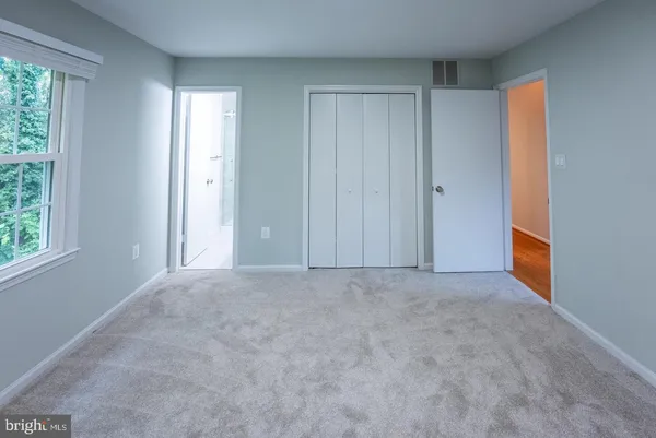 a view of an empty room and window