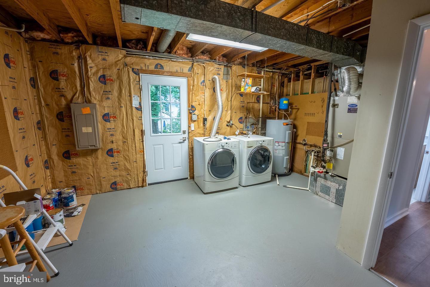 5629 Signal Point Court Burke, VA 22015 - Photo 42 of 48 a utility room with dryer and washer